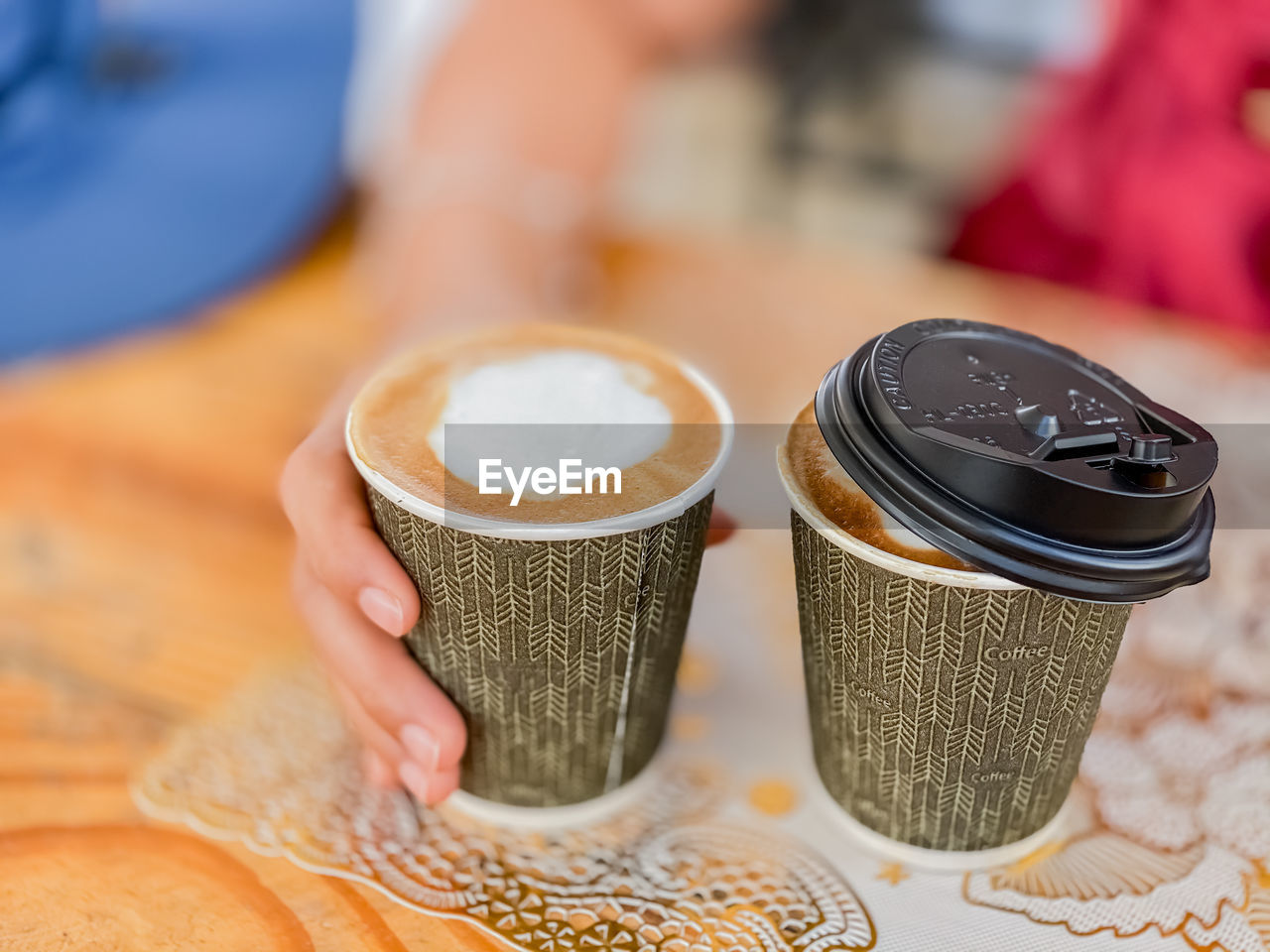 Midsection of coffee cup on table