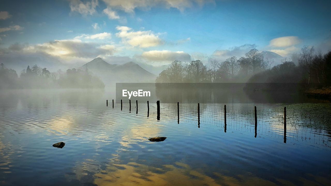 morning, reflection, dawn, water, fog, sunrise, sunlight, nature, mist, scenics - nature, beauty in nature, sky, lake, tranquility, environment, landscape, tranquil scene, cloud, animal, tree, no people, mountain, animal themes, bird, animal wildlife, plant, outdoors, wildlife, sun, travel destinations, land, twilight, idyllic, horizon, forest, travel, wood, day, non-urban scene