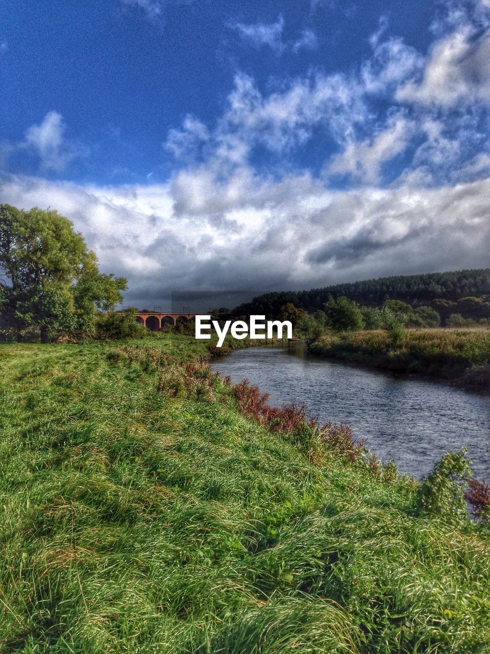 VIEW OF LANDSCAPE AGAINST CLOUDY SKY