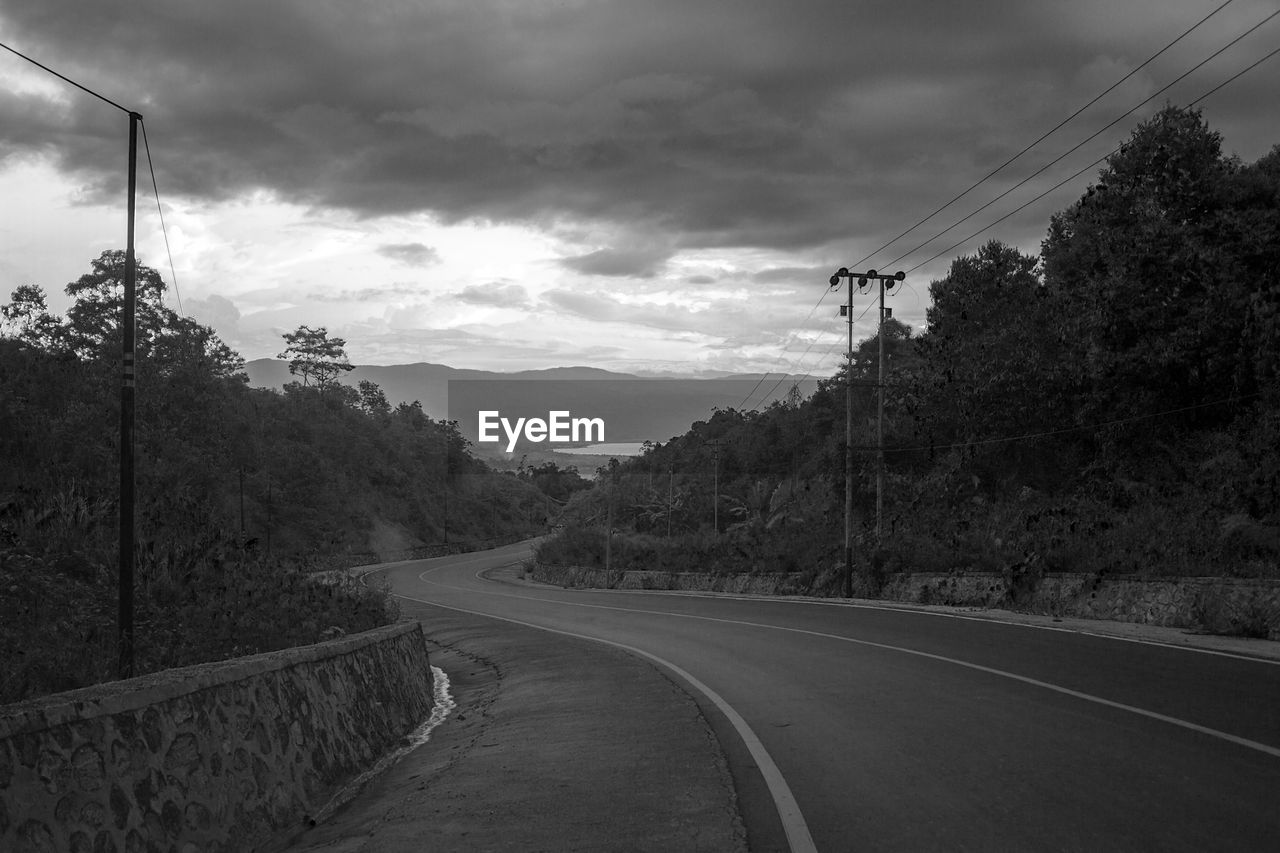 Empty road against sky