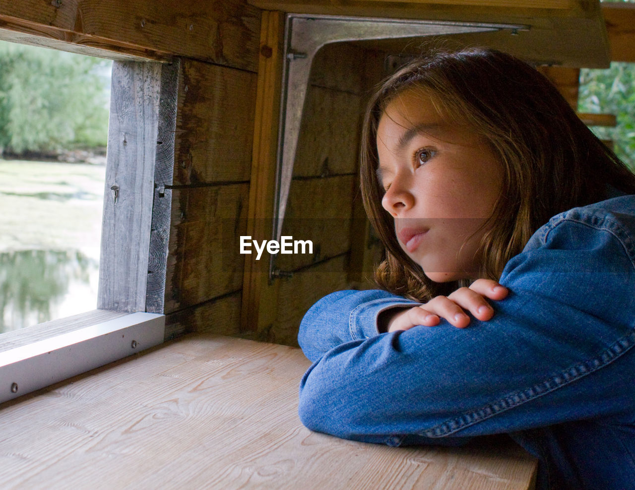 Girl looking out of window 