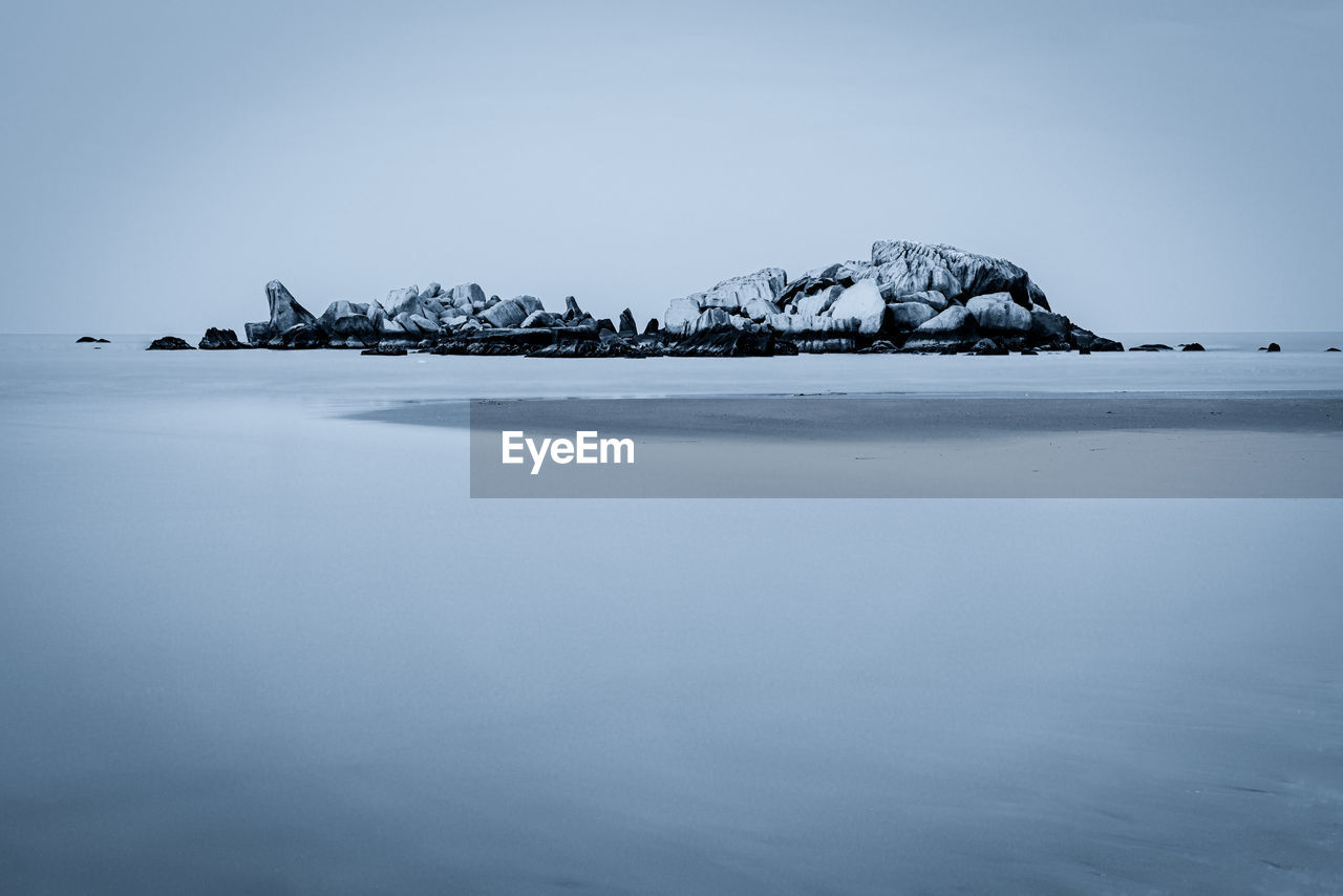 Scenic view of sea against sky during winter