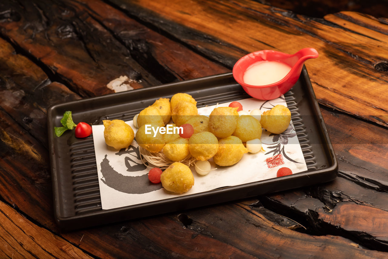 food and drink, food, wood, freshness, healthy eating, produce, no people, fruit, wellbeing, table, high angle view, tray, meal, dish, indoors, still life, rustic