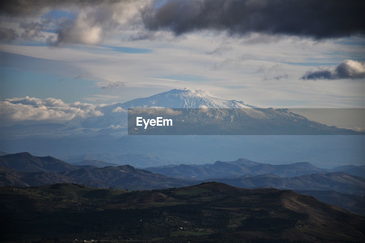 Scenic view of mountains against sky during winter