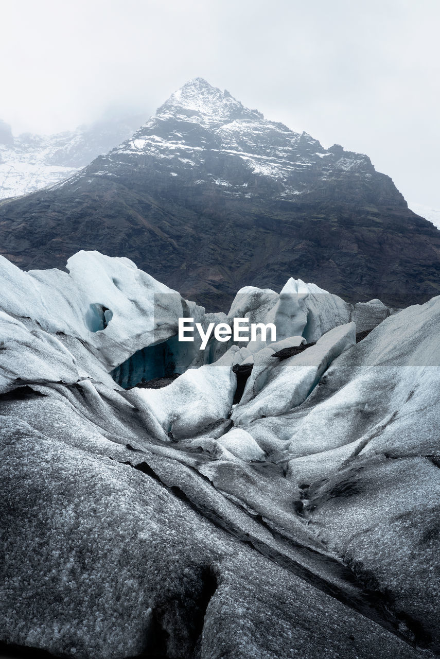 At the southern end of glacier in iceland, surrounded by mountains