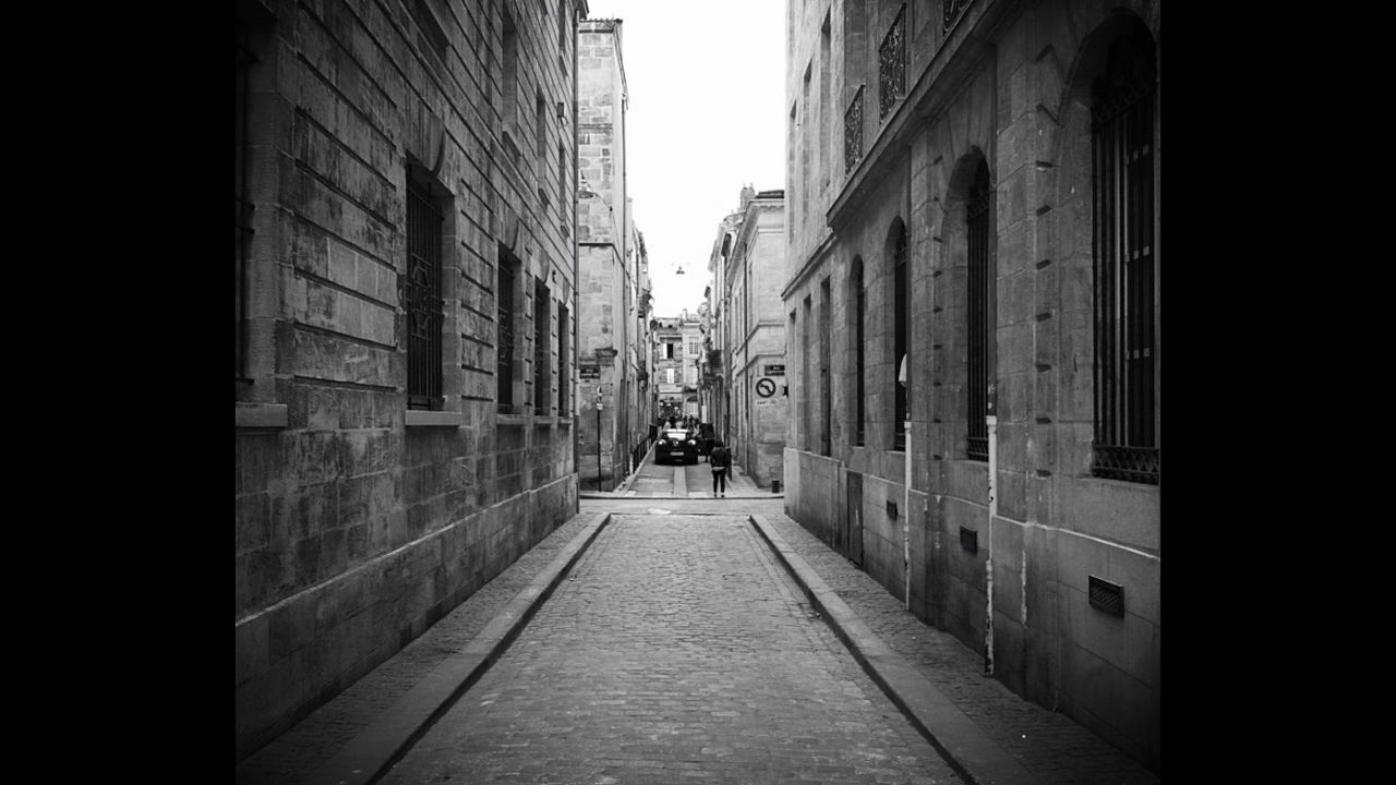 Alley amidst buildings in city