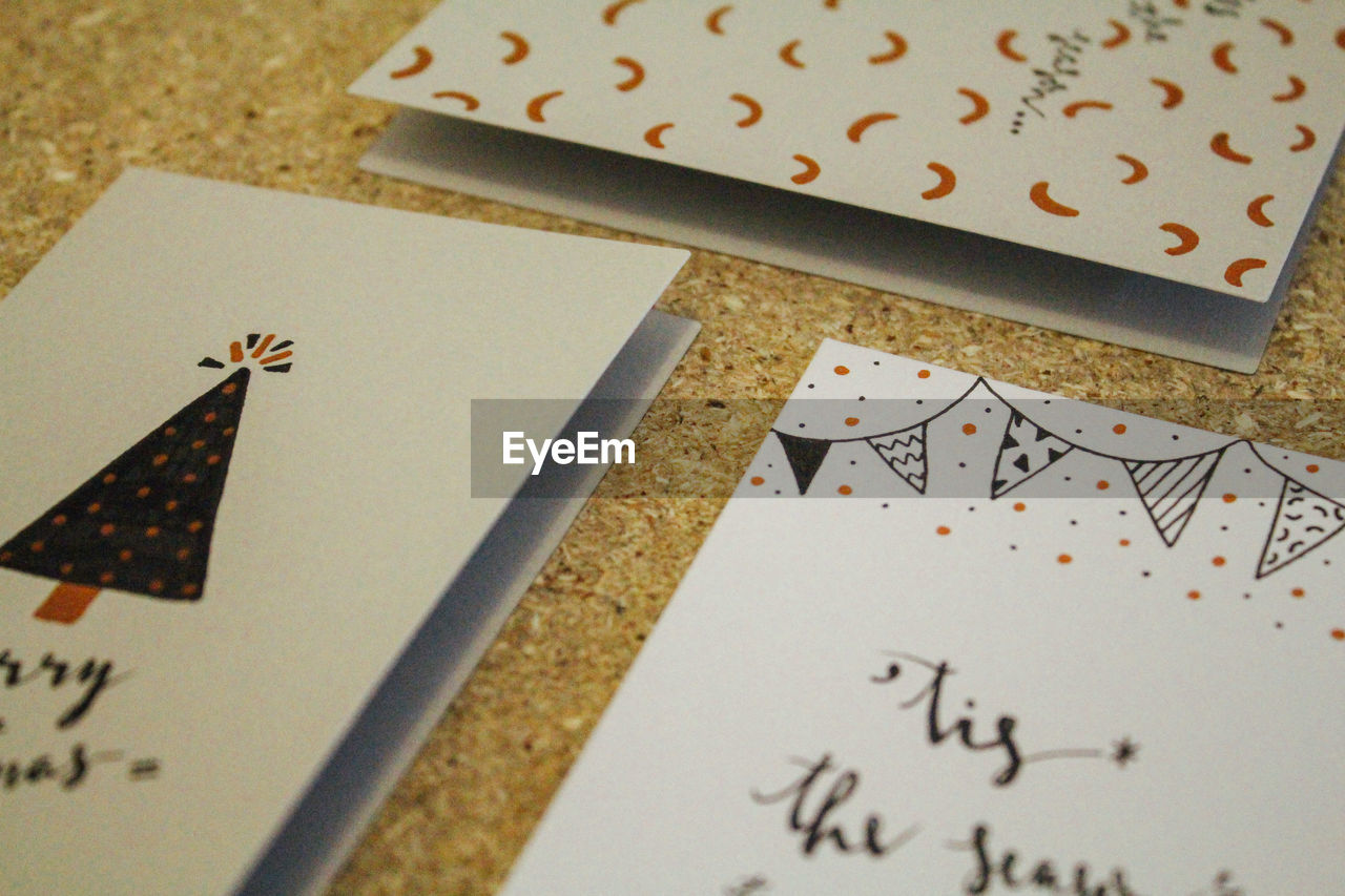 Close-up of christmas cards on table