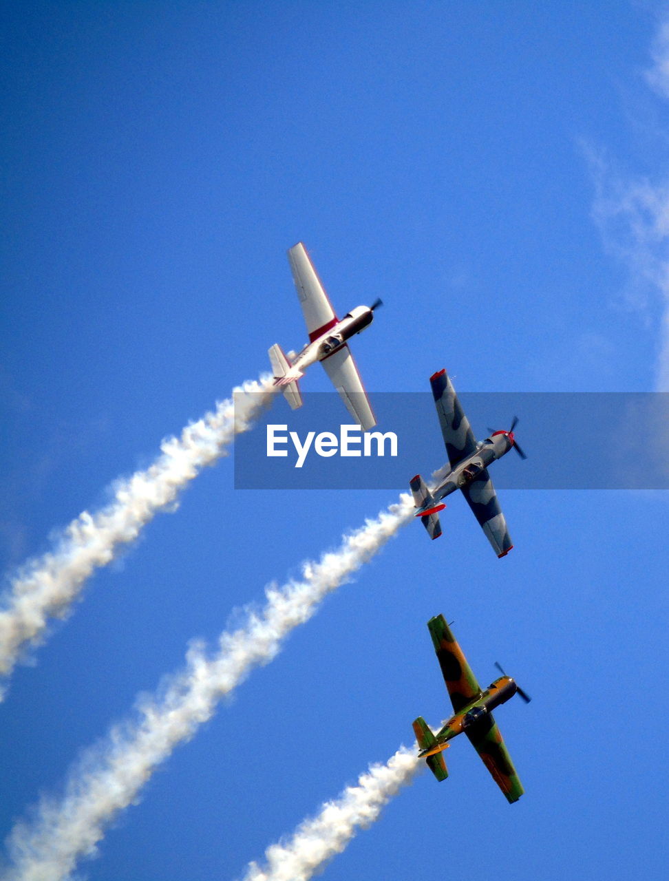 LOW ANGLE VIEW OF AIRPLANE FLYING IN SKY