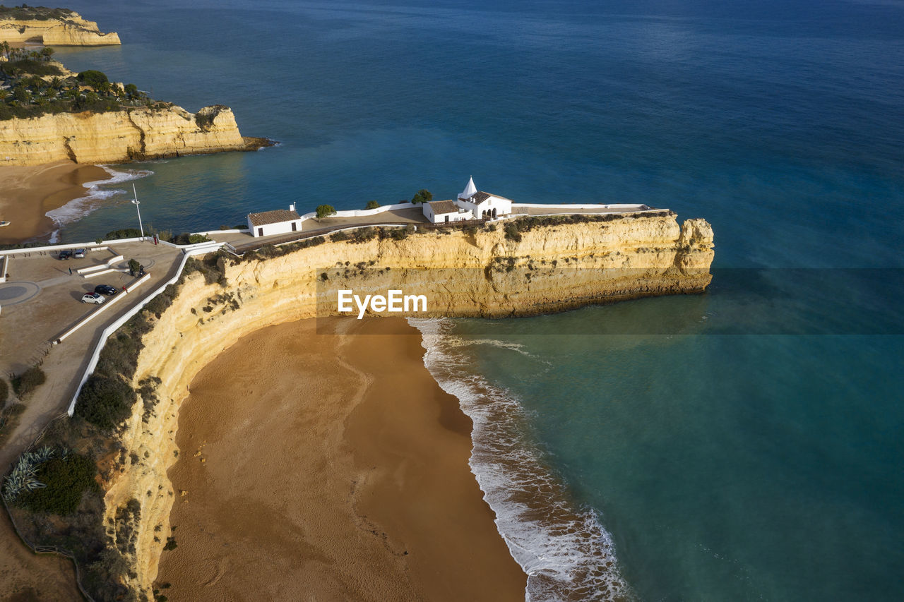 Portugal, faro district, drone view of fort of nossa senhora da rocha and praia nova beach