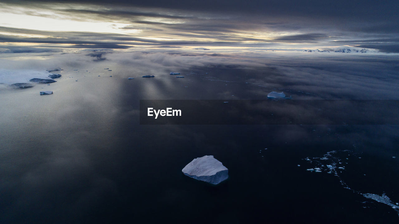 Aerial view of frozen sea against sky