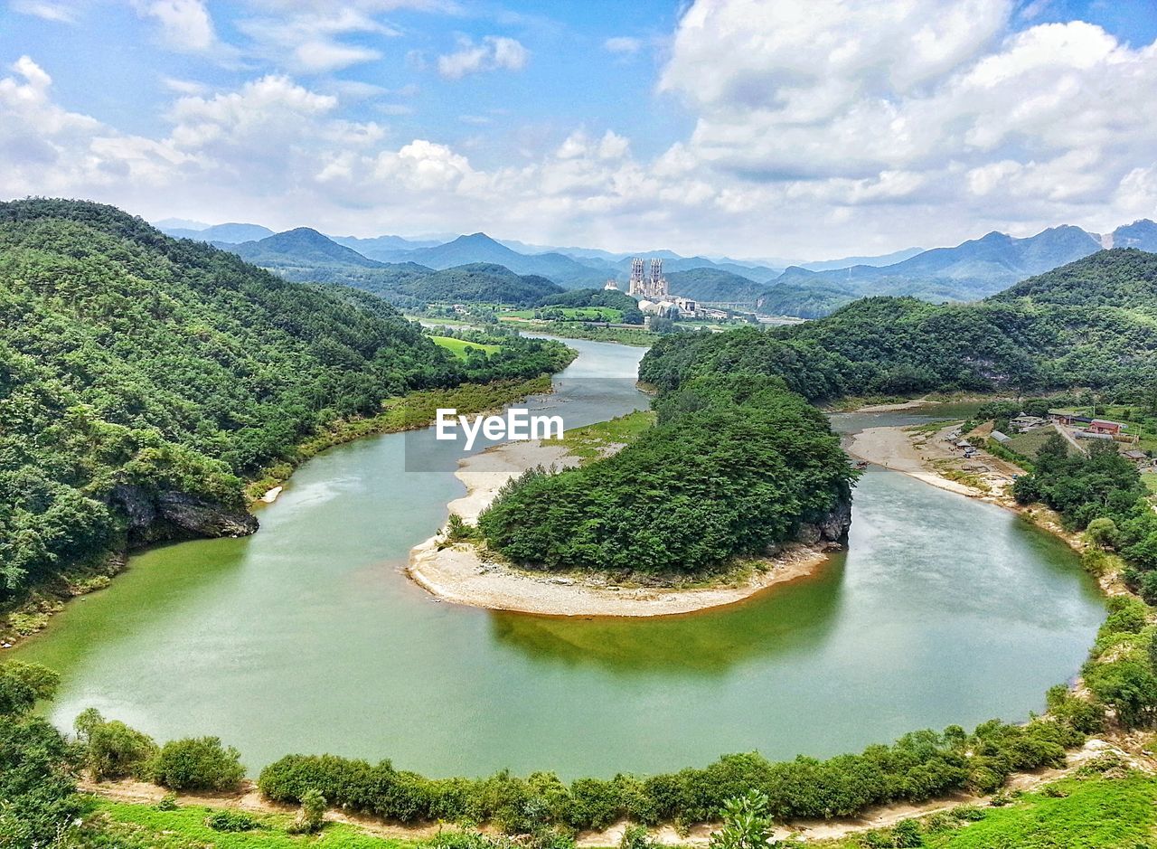 High angle view of river against cloudy sky