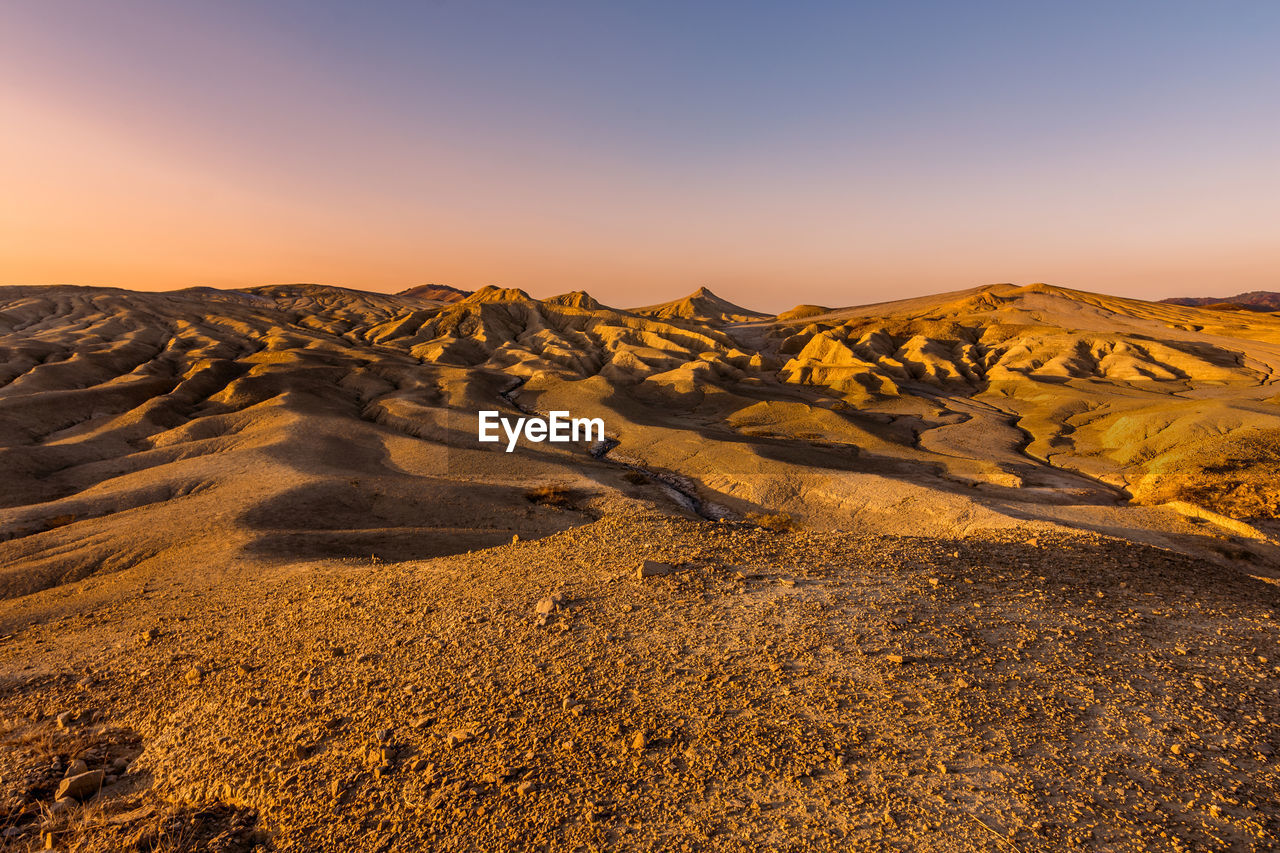 Scenic view of landscape against sky during sunset