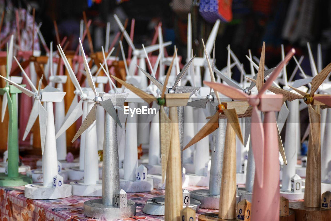 Close-up of wind turbine figurines for sale at market stall