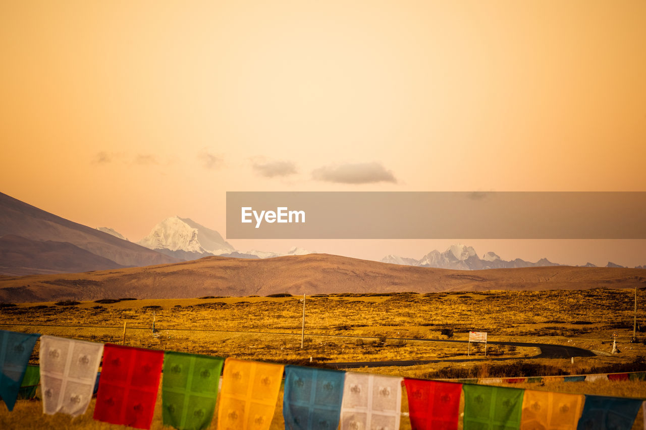 Scenic view of field against sky during sunset