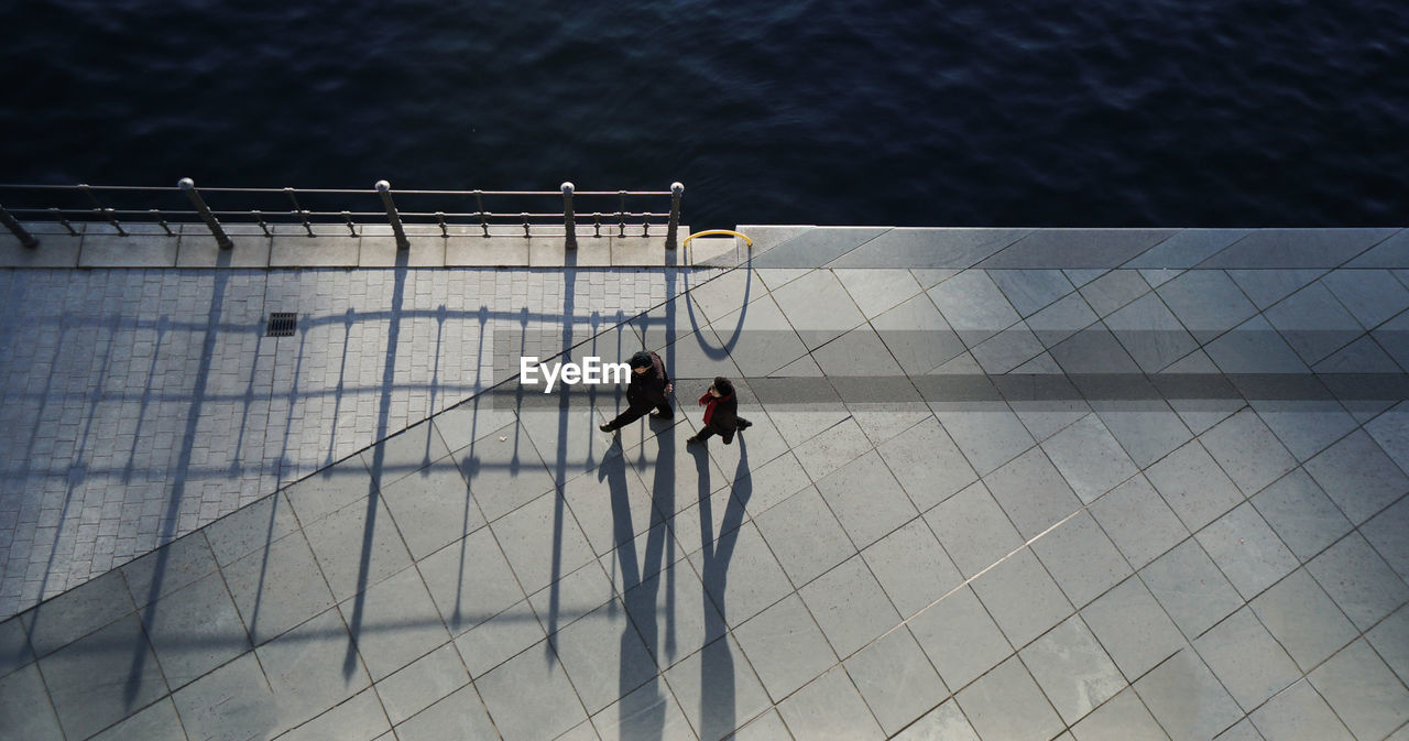 High angle view of people walking on promenade