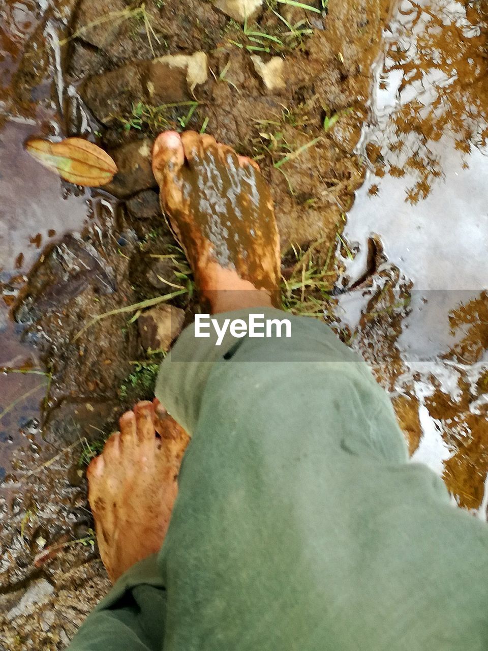 LOW SECTION OF MAN BY WATER