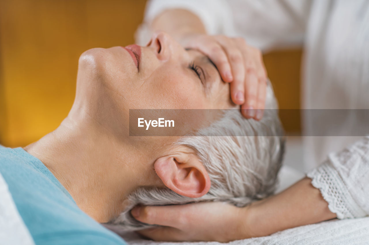 Close-up of woman getting massage at spa