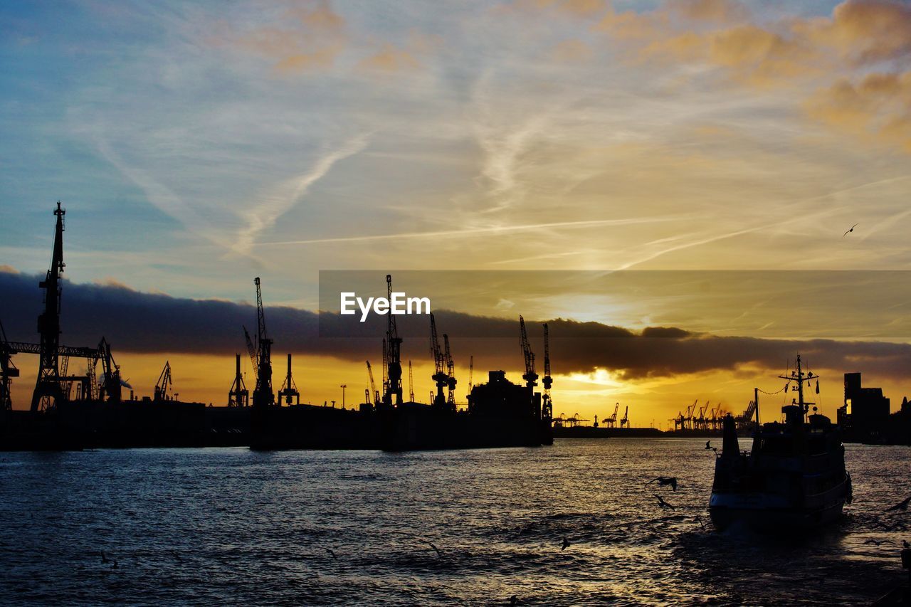 Silhouette ship sailing at port of hamburg