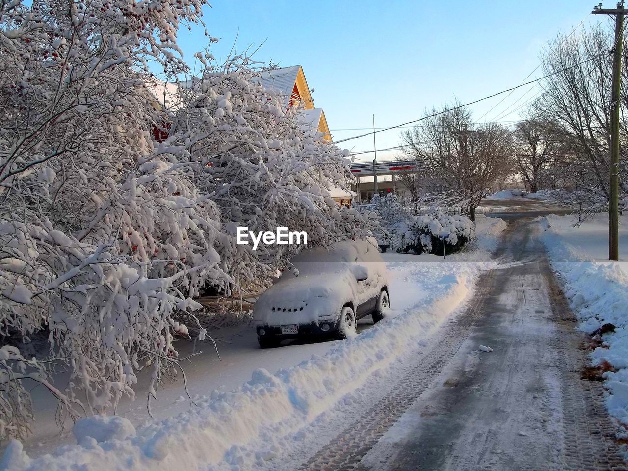 SNOW ON ROAD AGAINST SKY