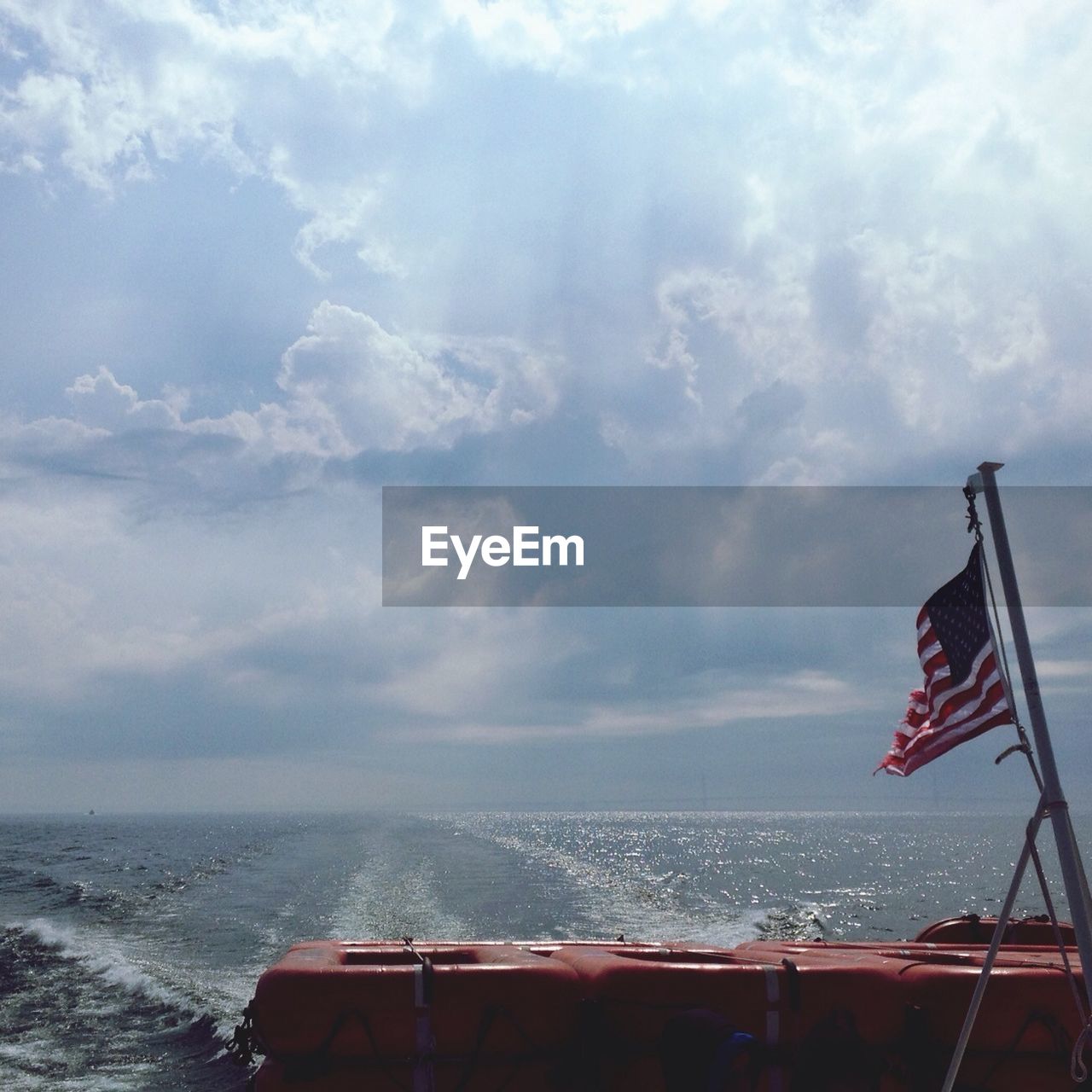 Life boat with flag in sea