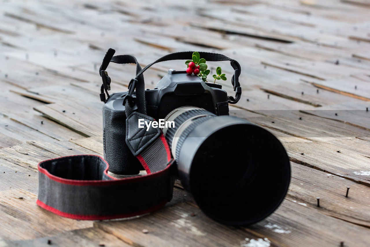 Close-up of camera on table