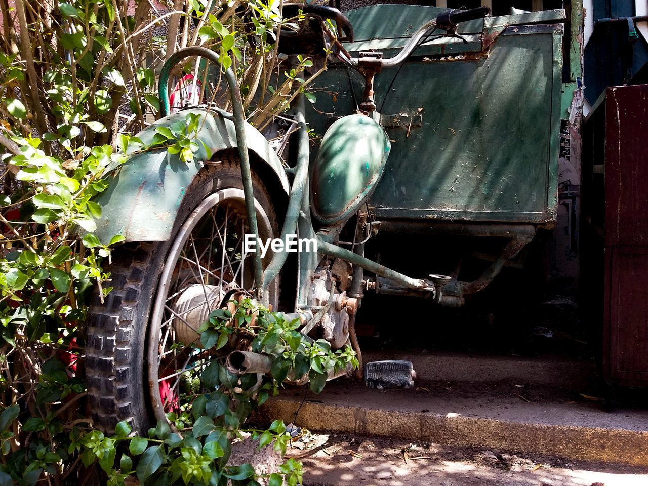 OLD ABANDONED CAR BY CART