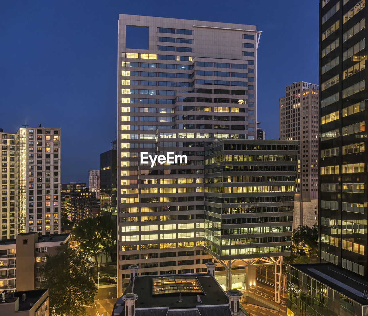 Modern buildings in city against clear sky