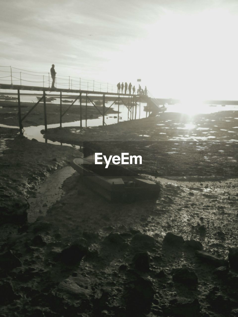 VIEW OF PEOPLE ON BEACH AGAINST SKY