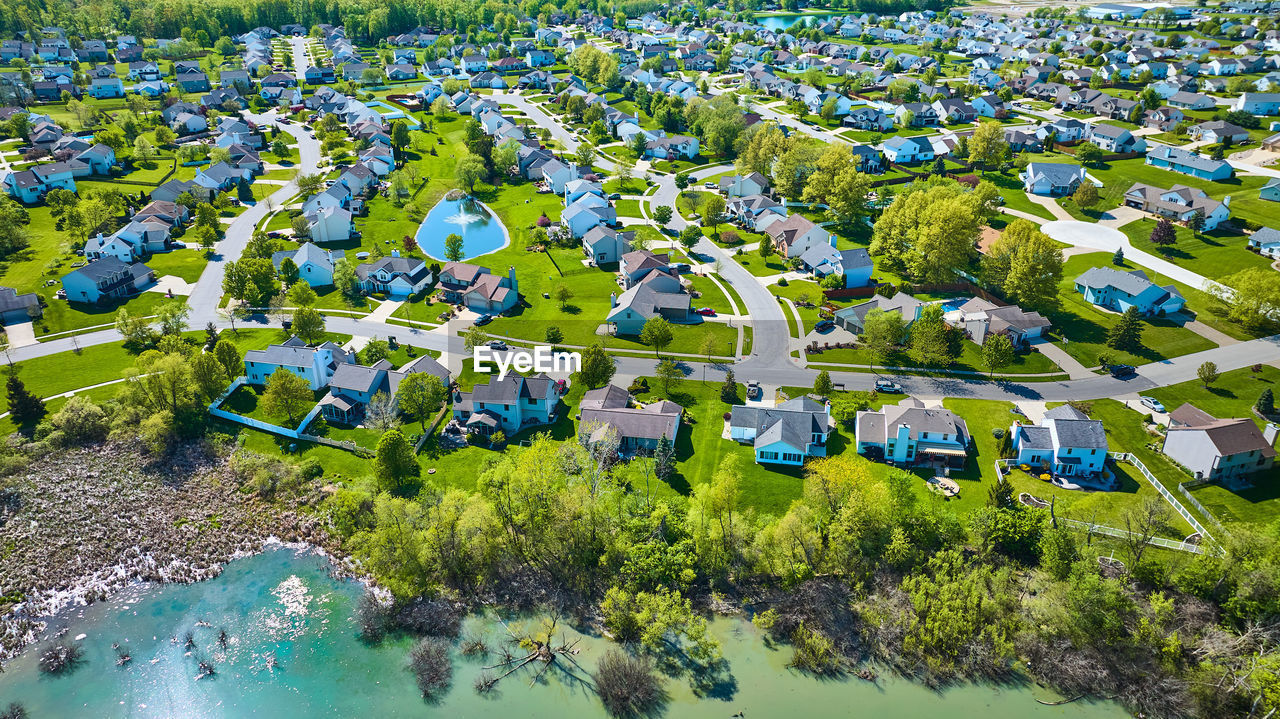 high angle view of townscape by lake