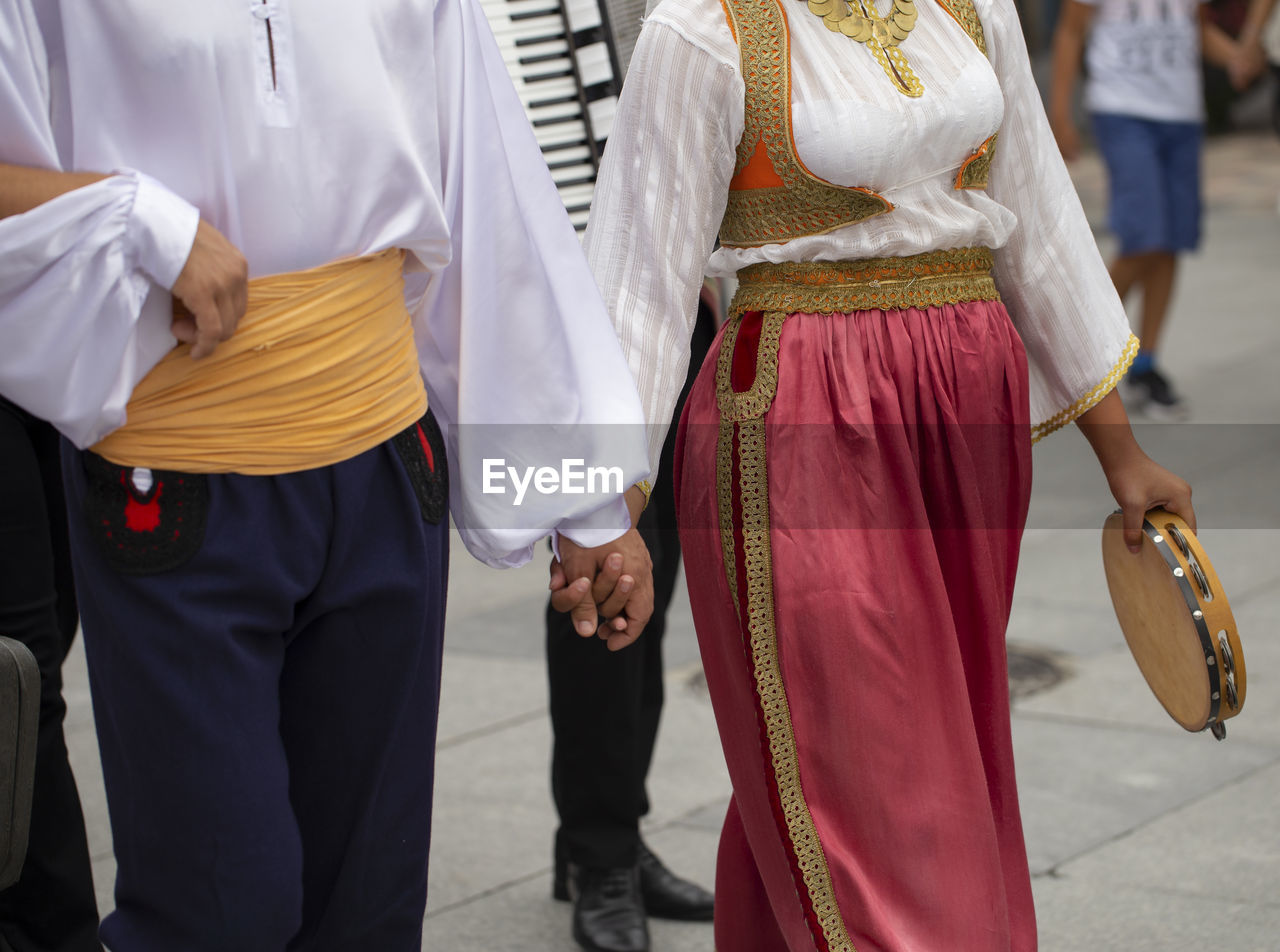 Midsection of people standing in temple