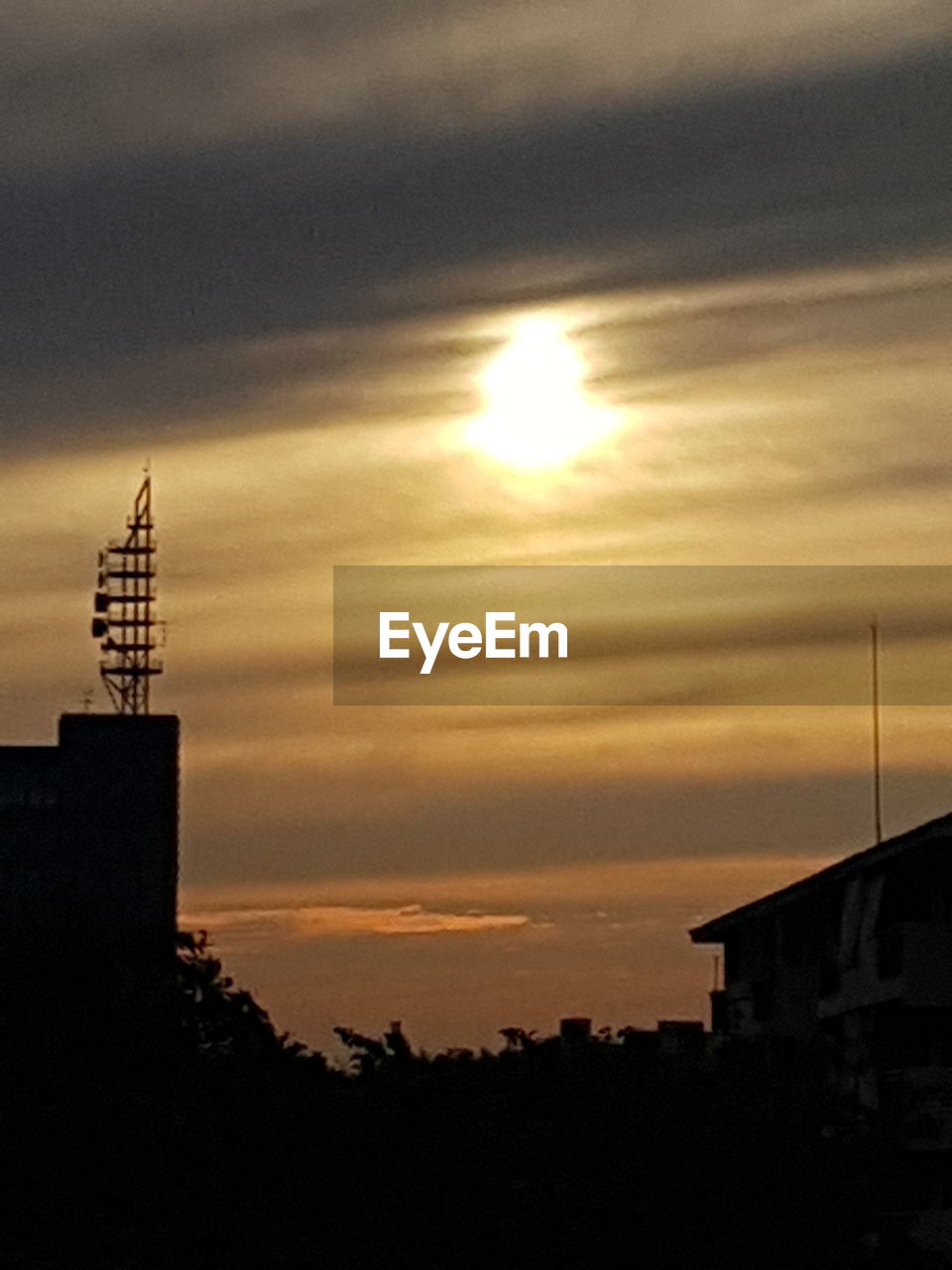 SILHOUETTE BUILDING AGAINST SKY DURING SUNSET