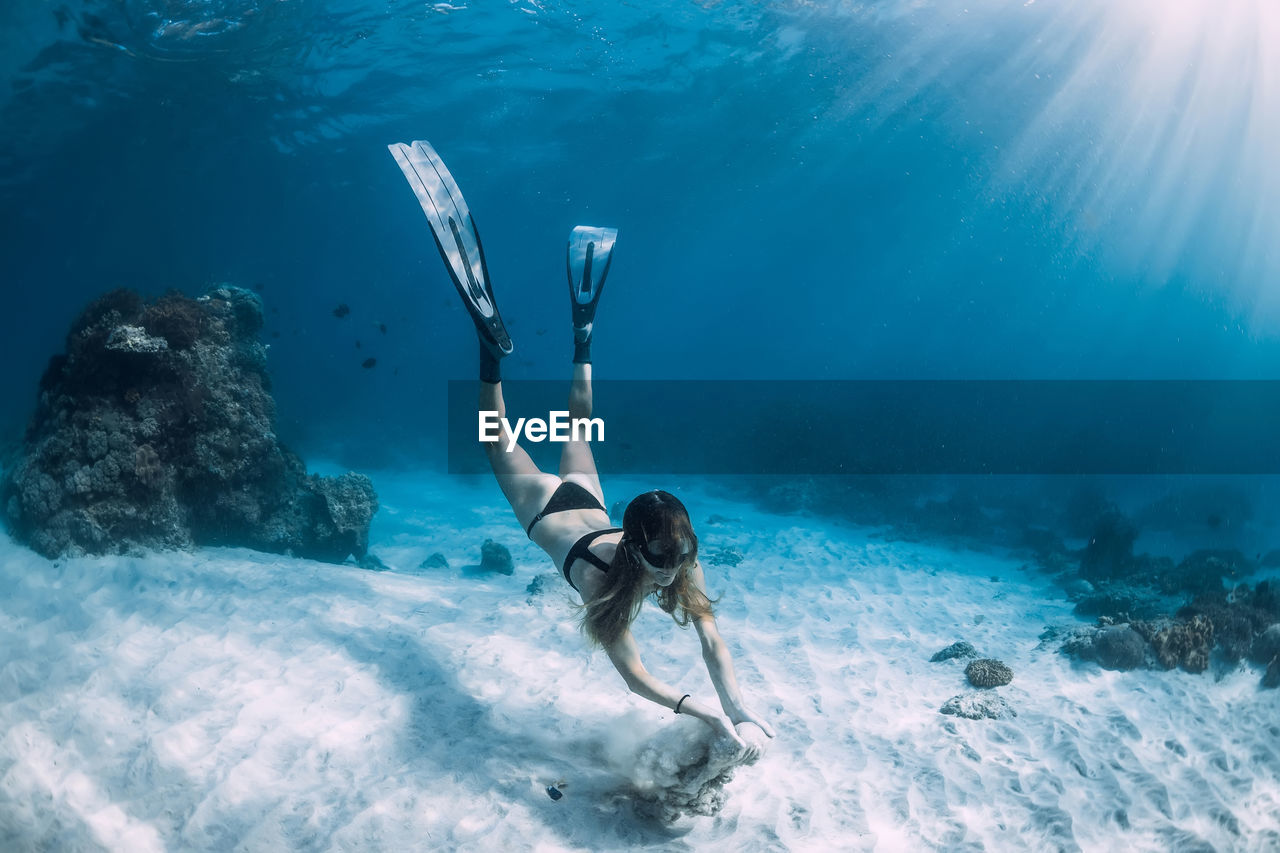 high angle view of man swimming in sea