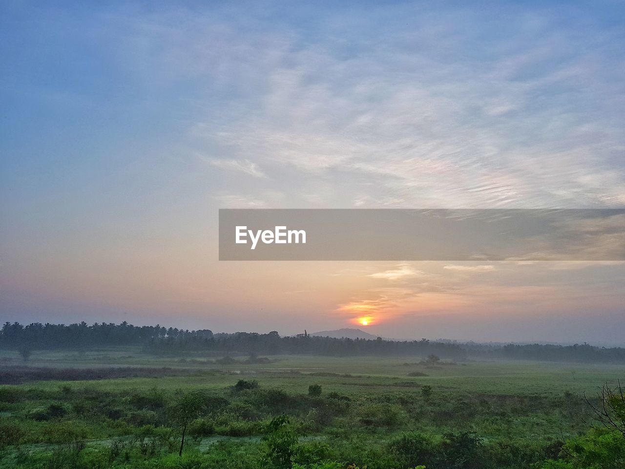 SCENIC VIEW OF LANDSCAPE AGAINST SKY DURING SUNSET