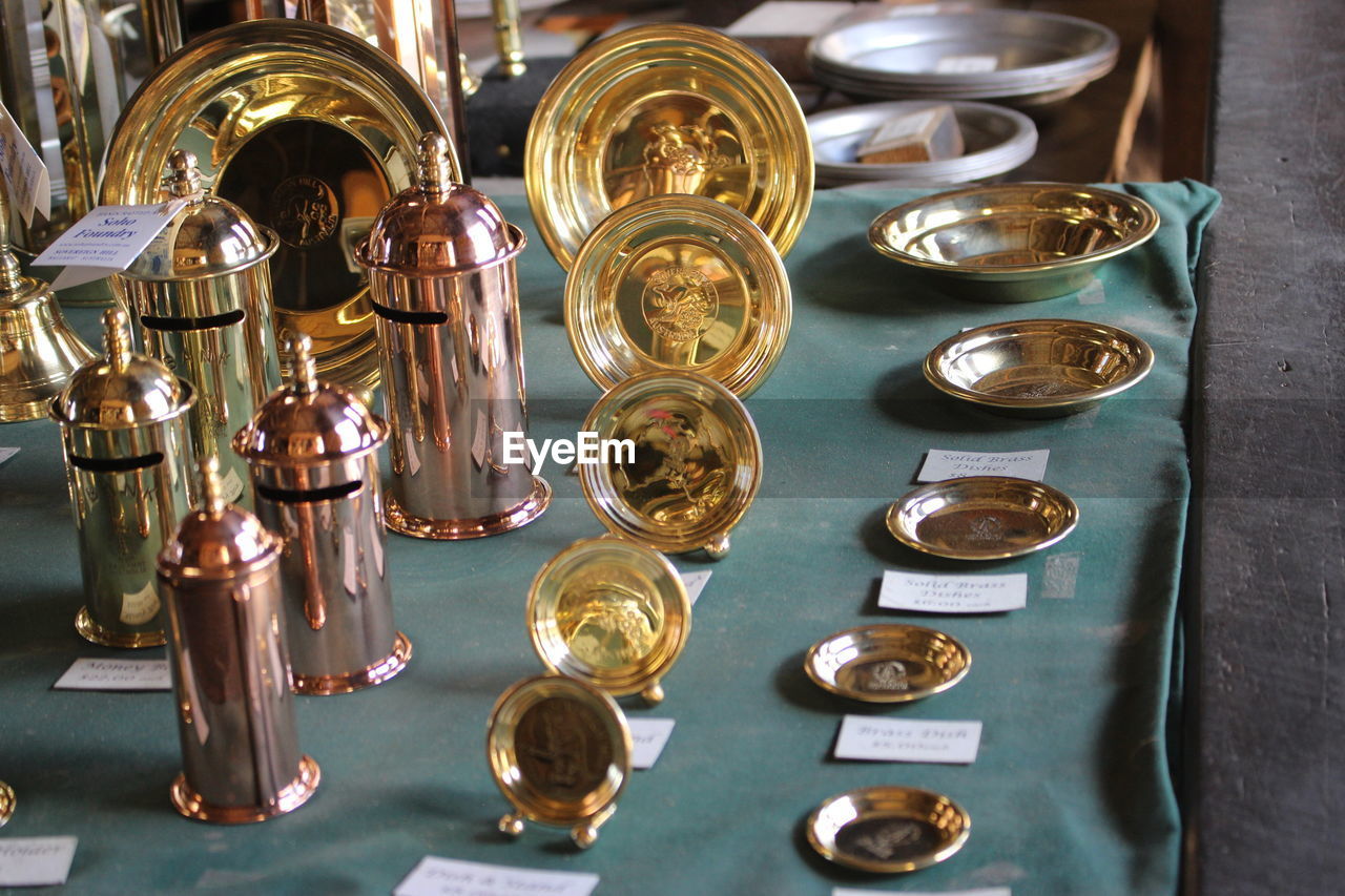 Copper and brass utensils for sale at market stall