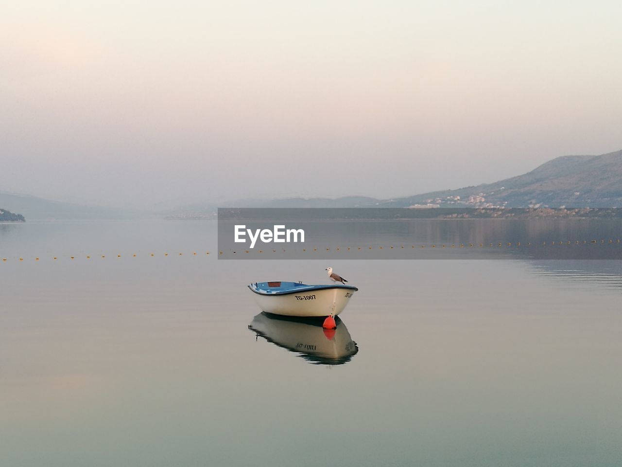 Boat in lake against sky