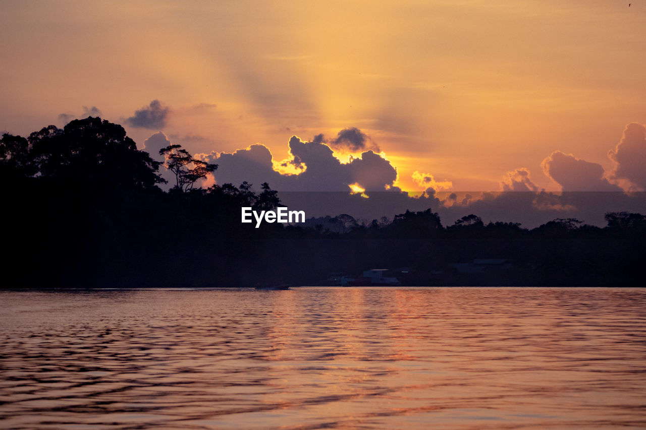 Scenic view of sea against orange sky