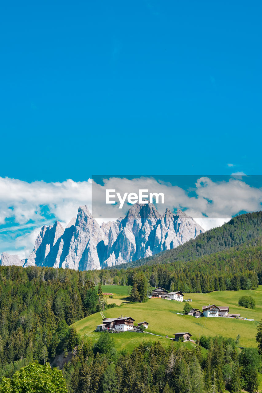 Scenic view of mountains against clear blue sky