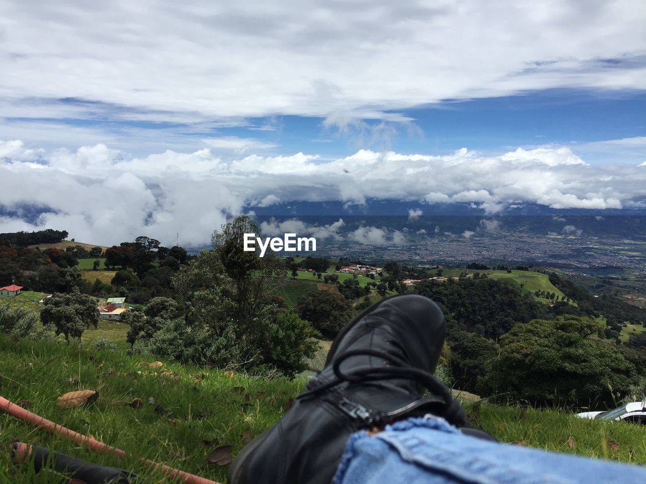 LOW SECTION OF MAN AGAINST MOUNTAIN
