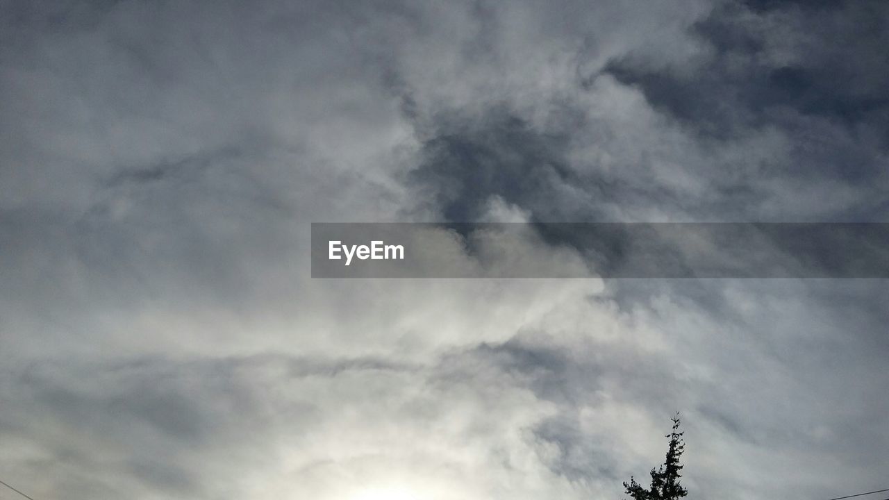 LOW ANGLE VIEW OF CLOUDY SKY AT SUNSET