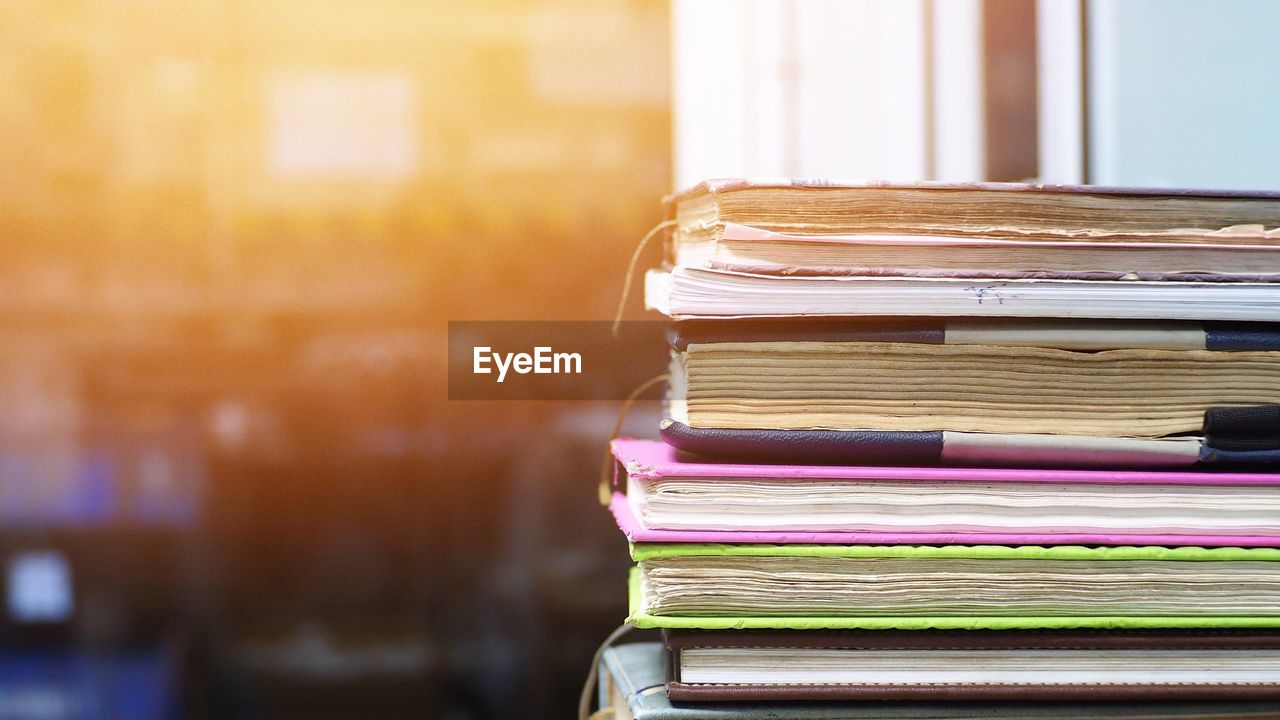 Close-up of stacked books on table