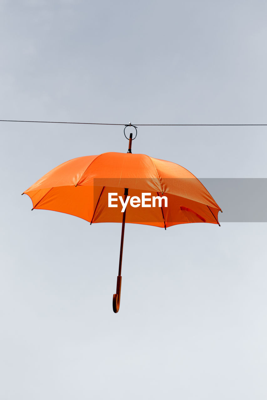 Umbrella hanging from line