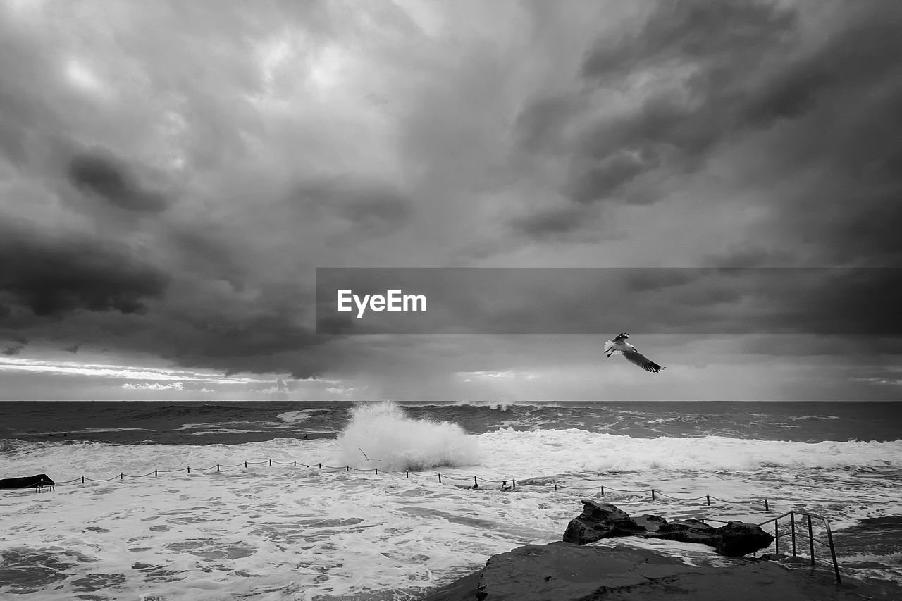 Scenic view of sea against cloudy sky