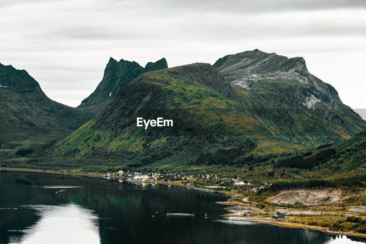 Scenic view of lake and mountains against sky