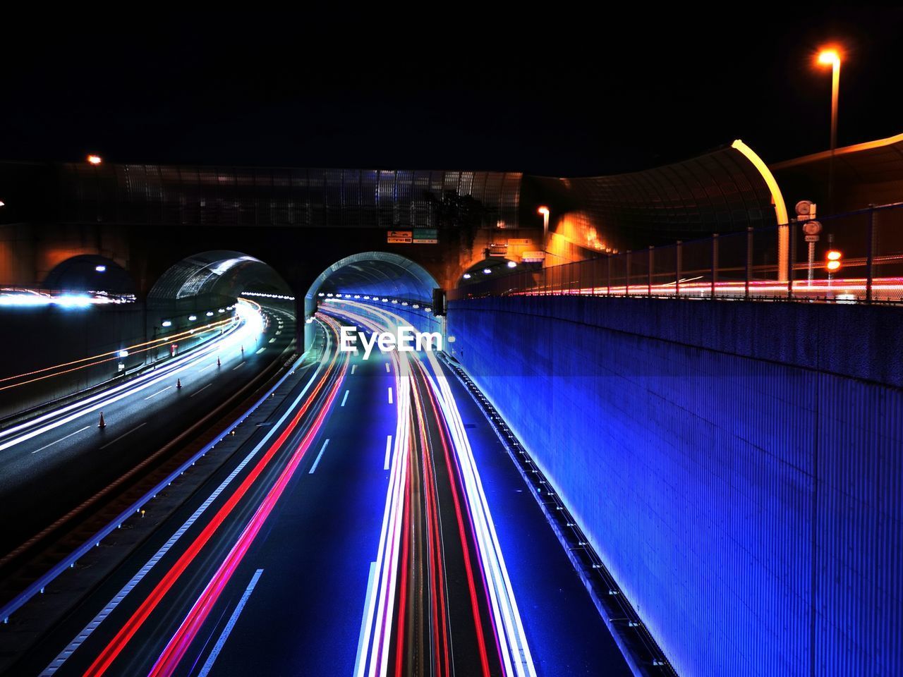 high angle view of light trails on road in city at night