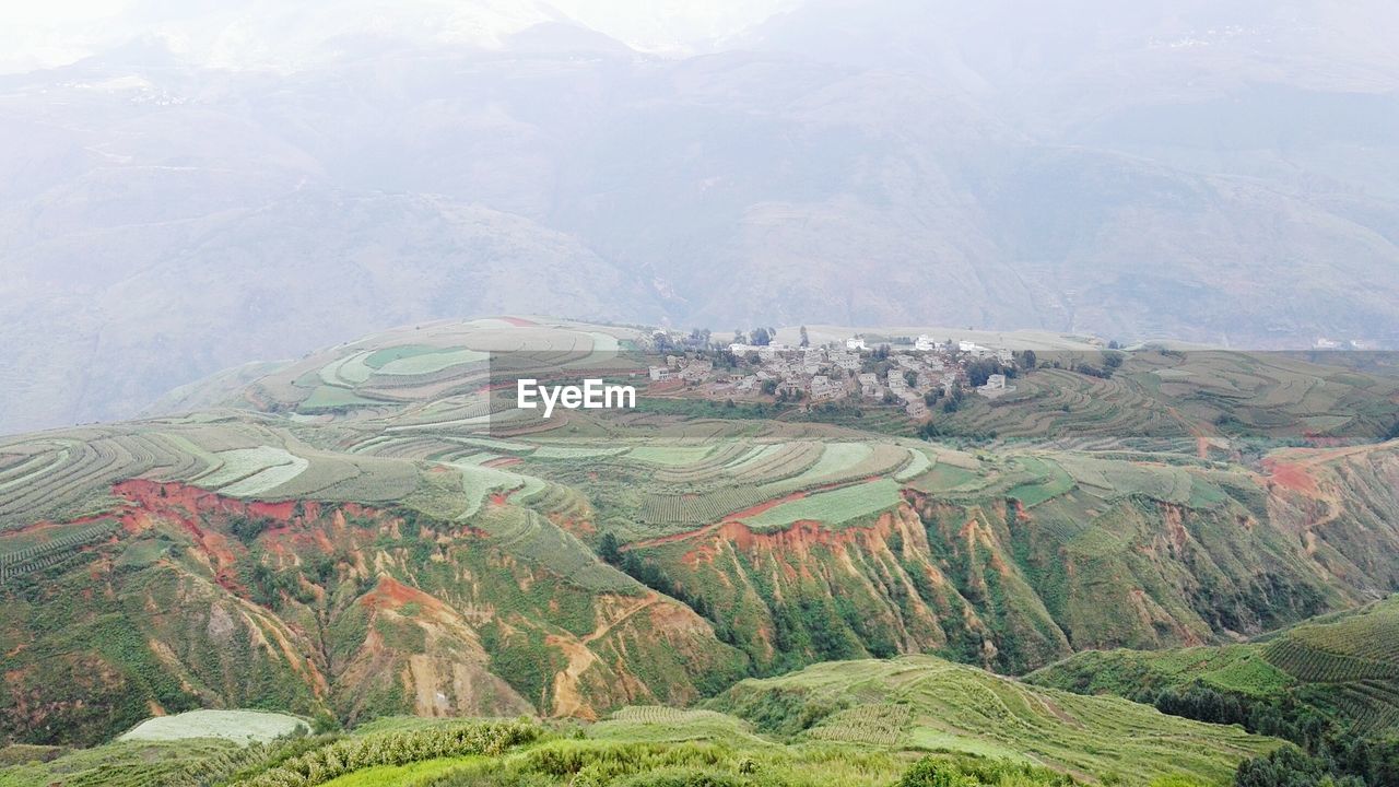 High angle view of terraced fields during foggy weather