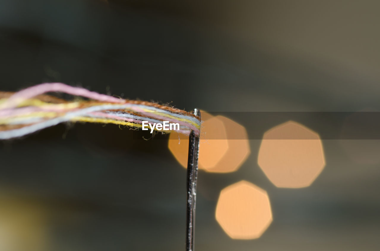 Close-up of threads in needle