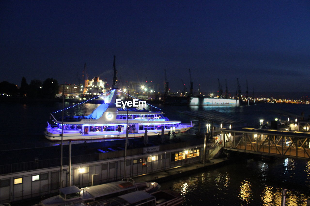 SHIP MOORED AT HARBOR