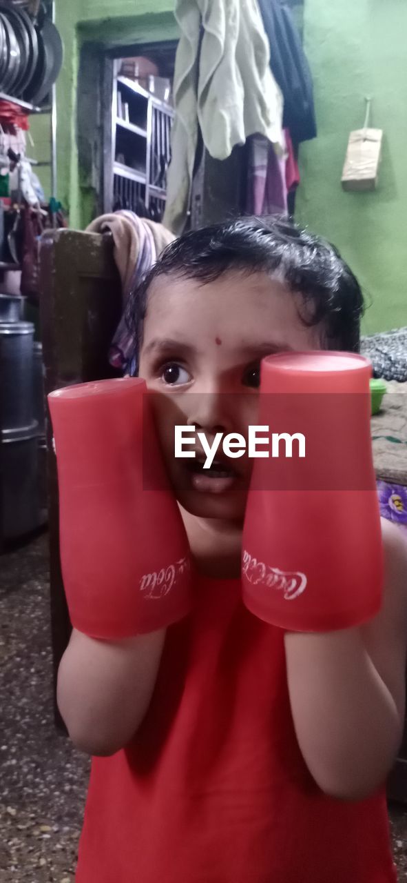PORTRAIT OF CUTE BOY WEARING RED AND SON