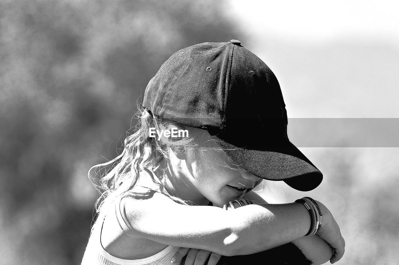 Close-up of girl wearing cap