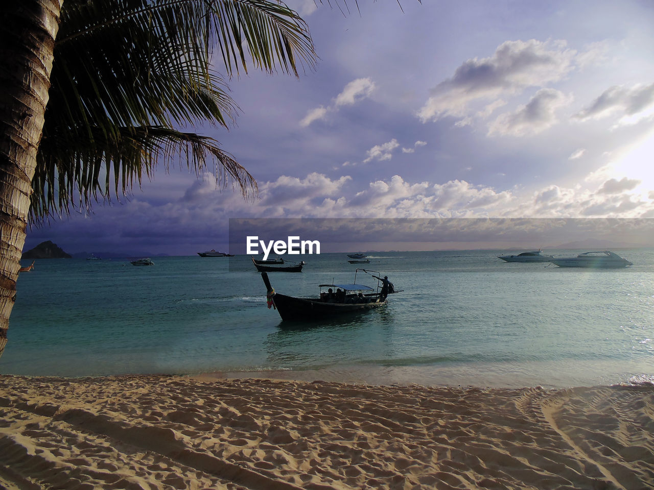 Boat moored at beach